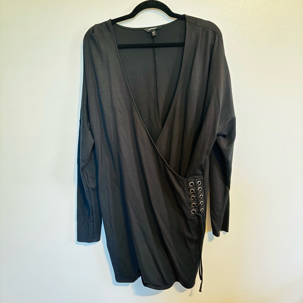Express black faux wrap dress with v neck and long sleeves.  Lace up detail at t